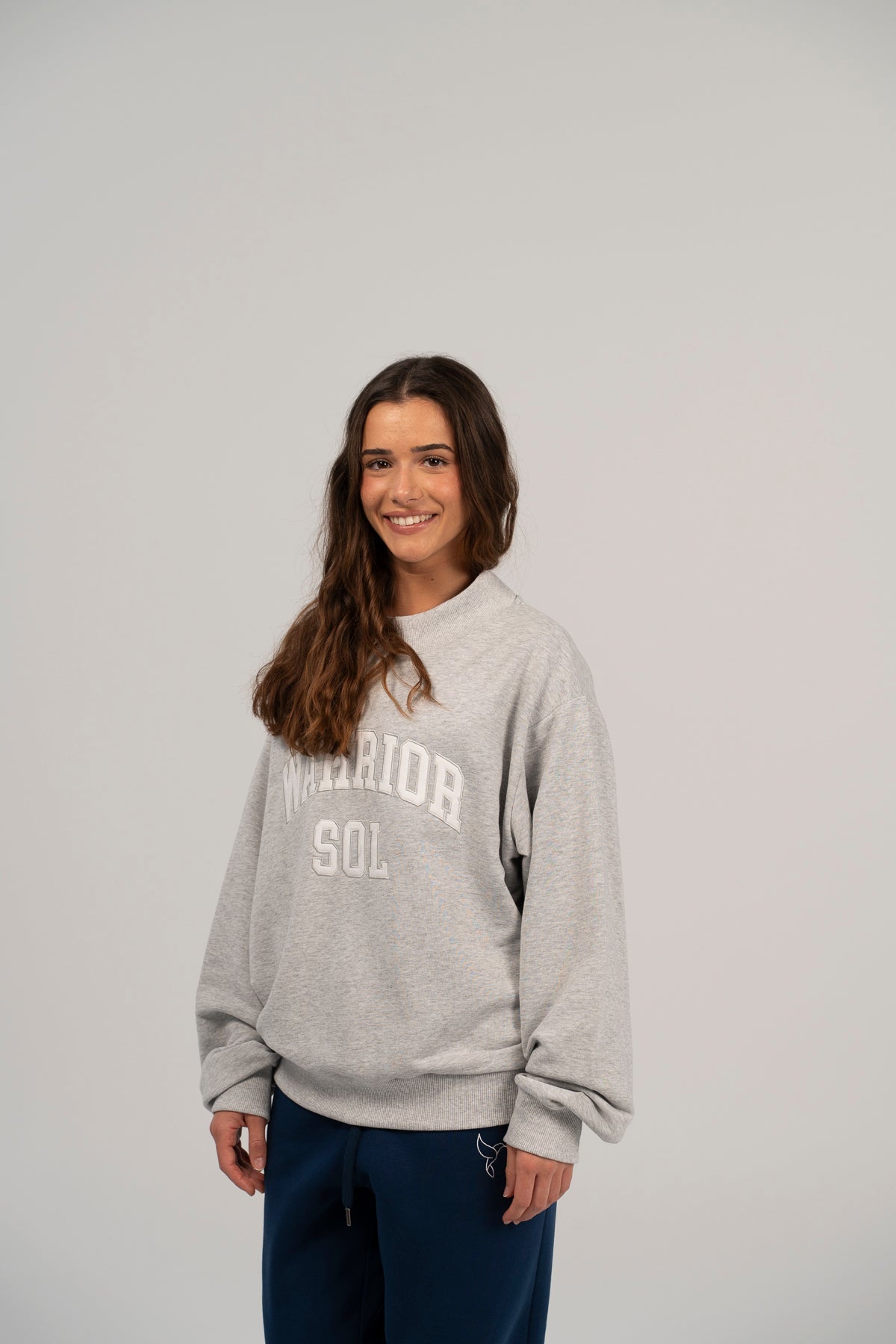 Warrior Sol Varsity Mockneck - lifestyle photo | mission-driven cancer support apparel
