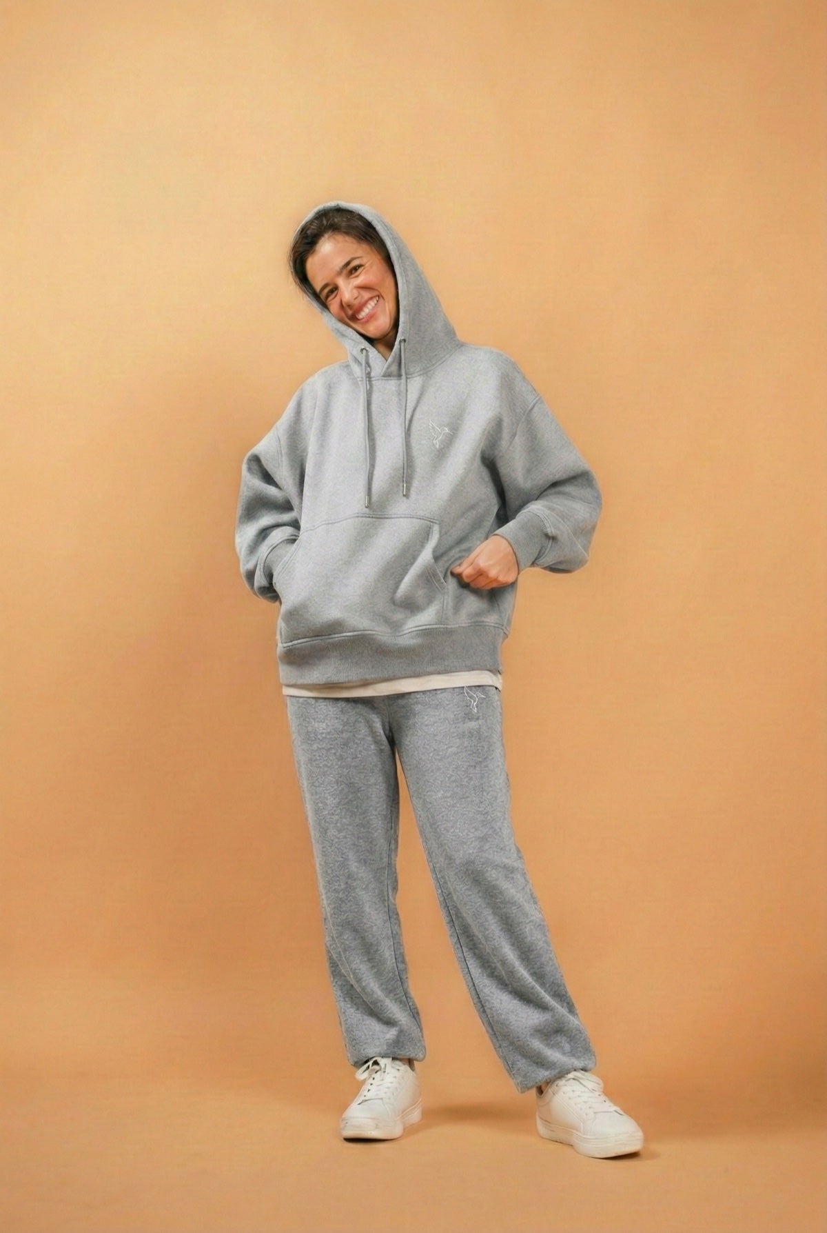 Warrior Sol All Day Sweatpants in Cloud Gray model relaxed pose gold campaign background