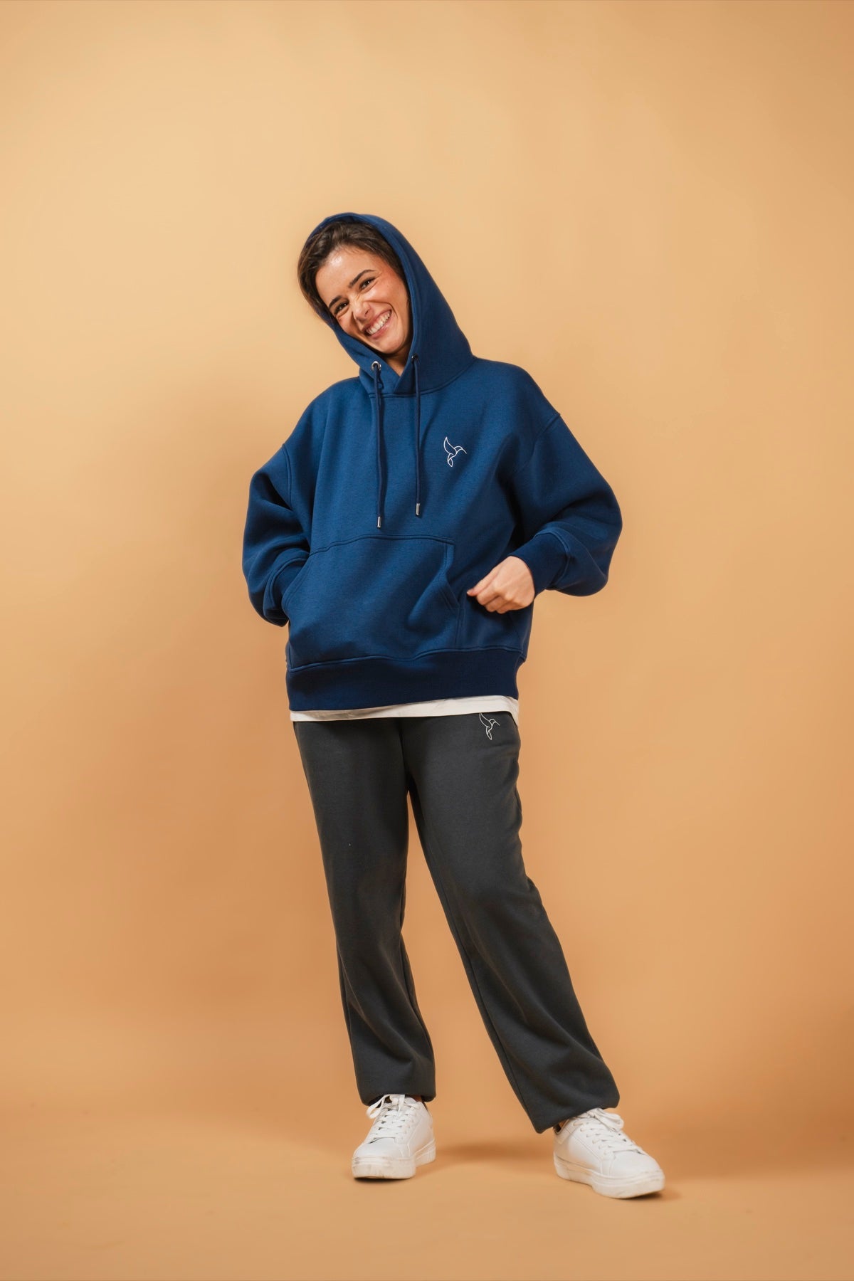 Warrior Sol All Day Sweatpants in Slate Gray model smiling gold campaign background