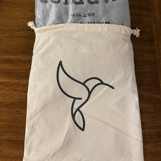 Varsity mockneck tucked in the hummingbird bag